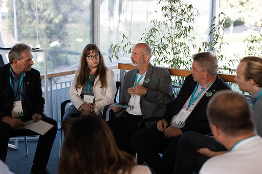 People sitting in a circle talking to each other